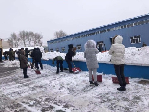 All the staff work together to clear the snow